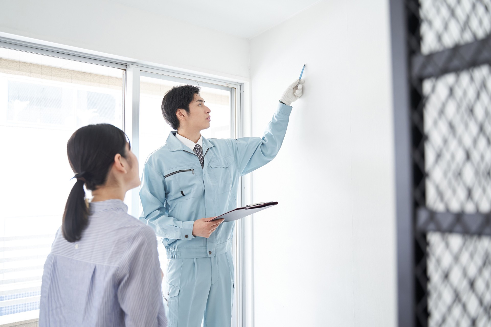 Japanese male worker checking the equipment in the room